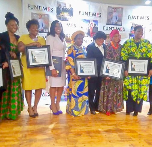 Standing with women being recognized at a leadership event